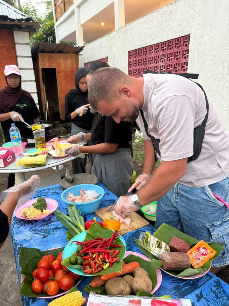 Close-up of hands preparing fish and vegetables for the evening meal