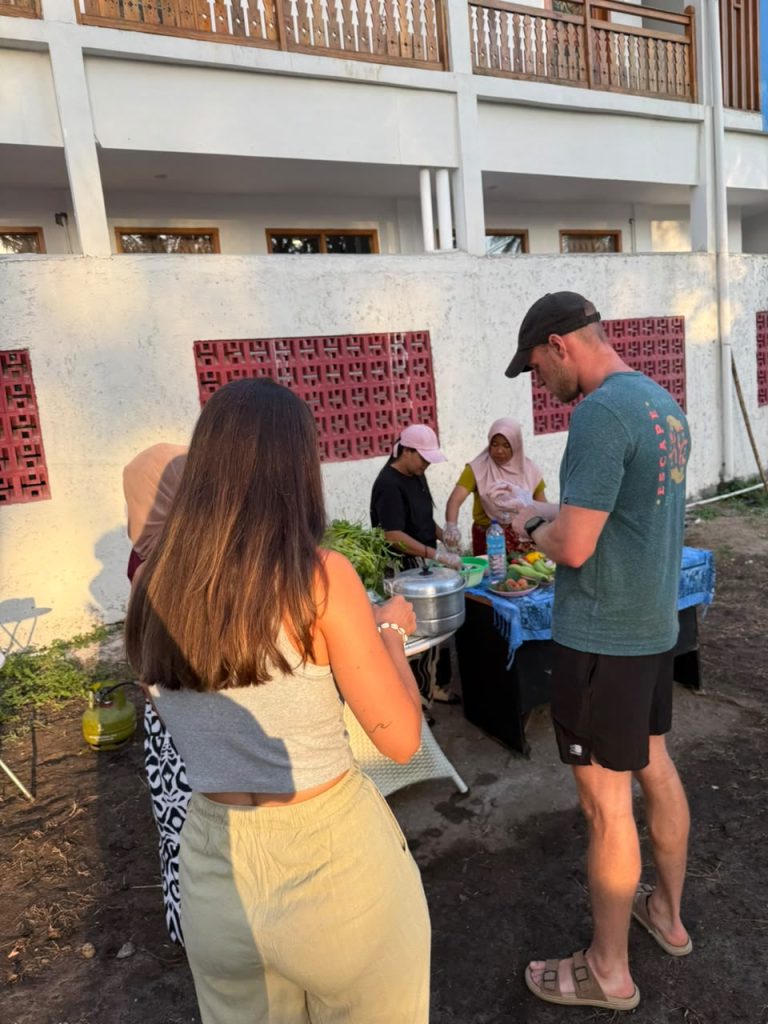 The host family serving food to guests outside their home
